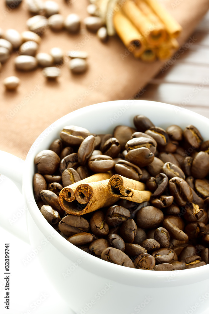 Coffee beans and Cinnamon Sticks in the cup