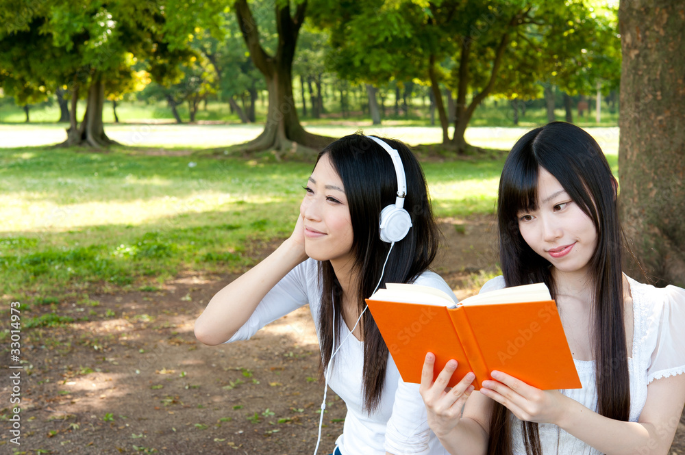 beautiful asian women relaxing in the park