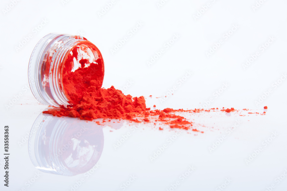 spilled red makeup powder