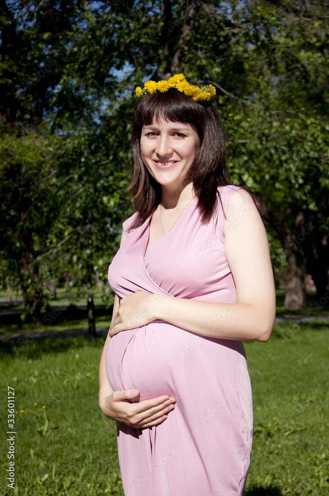 Portrait of the young beautiful girl in park