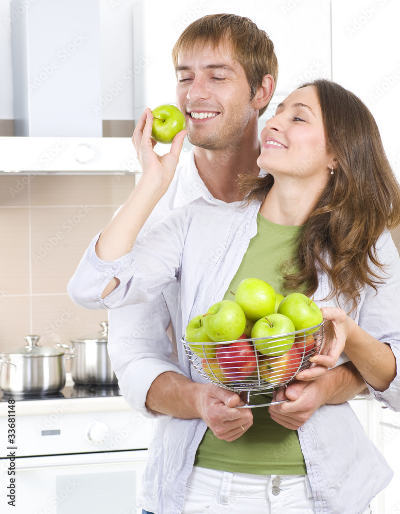 Lovely Sweet Couple eating fresh fruits. Healthy food. Diet