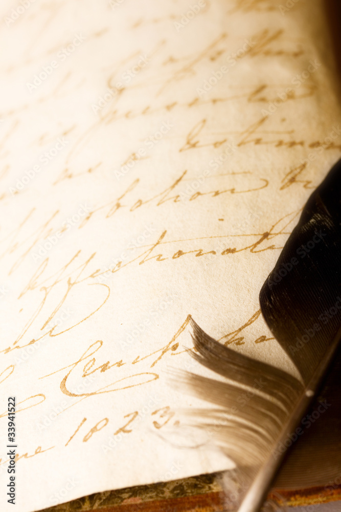 Feather and old book