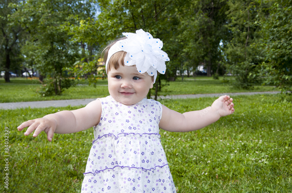 cute little girl dancing in the park