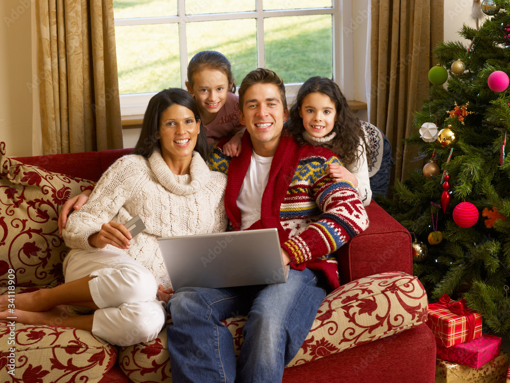 Hispanic family Christmas shopping online