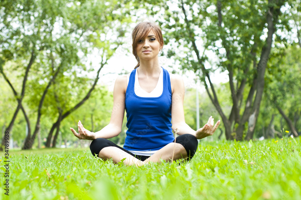 yoga woman on green grass