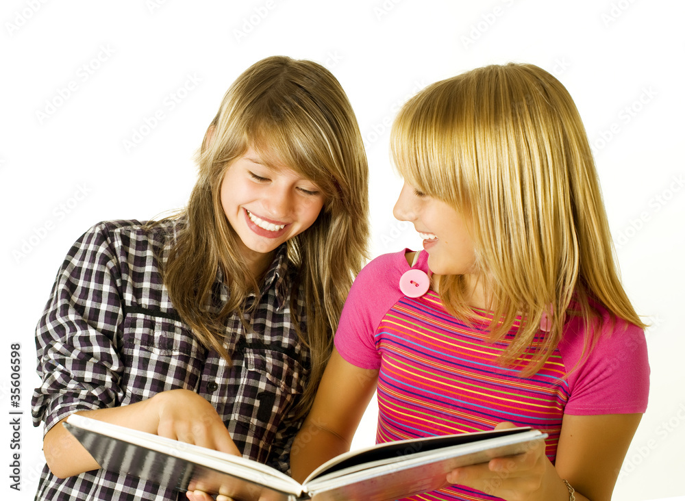 Two Teenage Girls reading The Book. Education