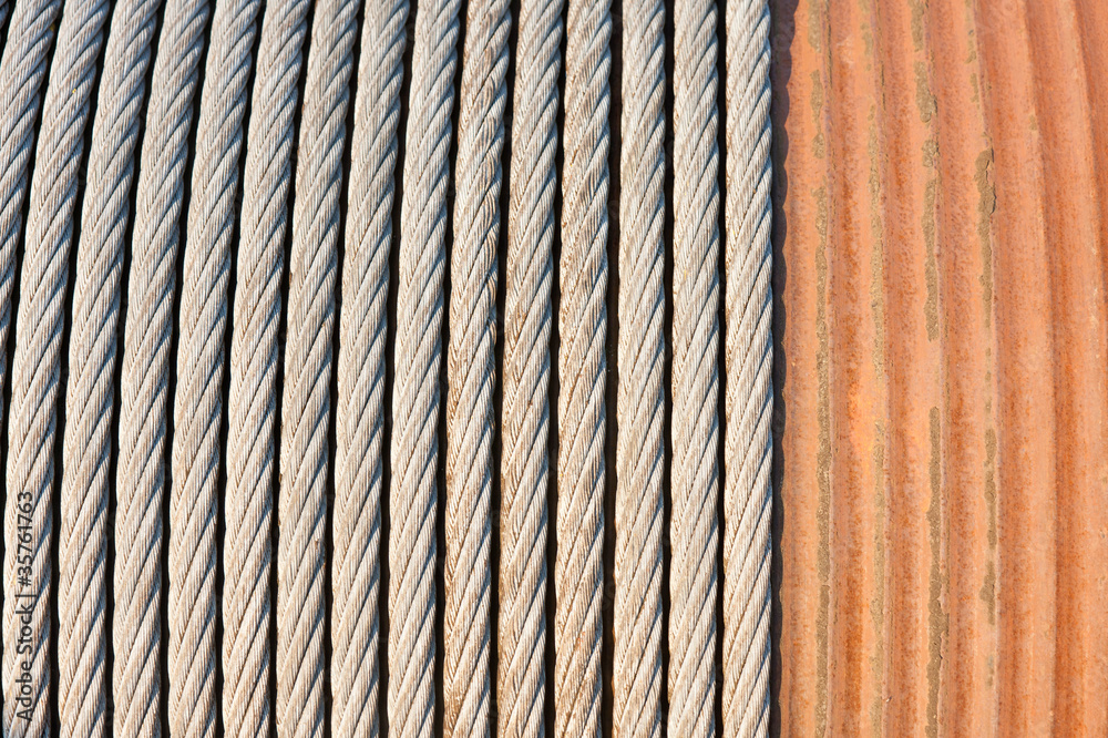 Detail of a big winch winding a steel cable