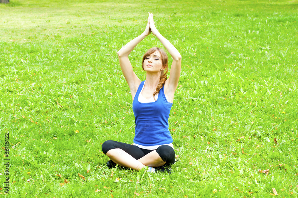 yoga woman on green grass