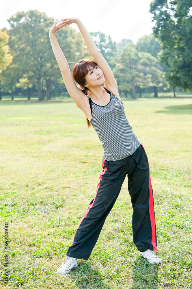 beautiful asian woman exercising in the park