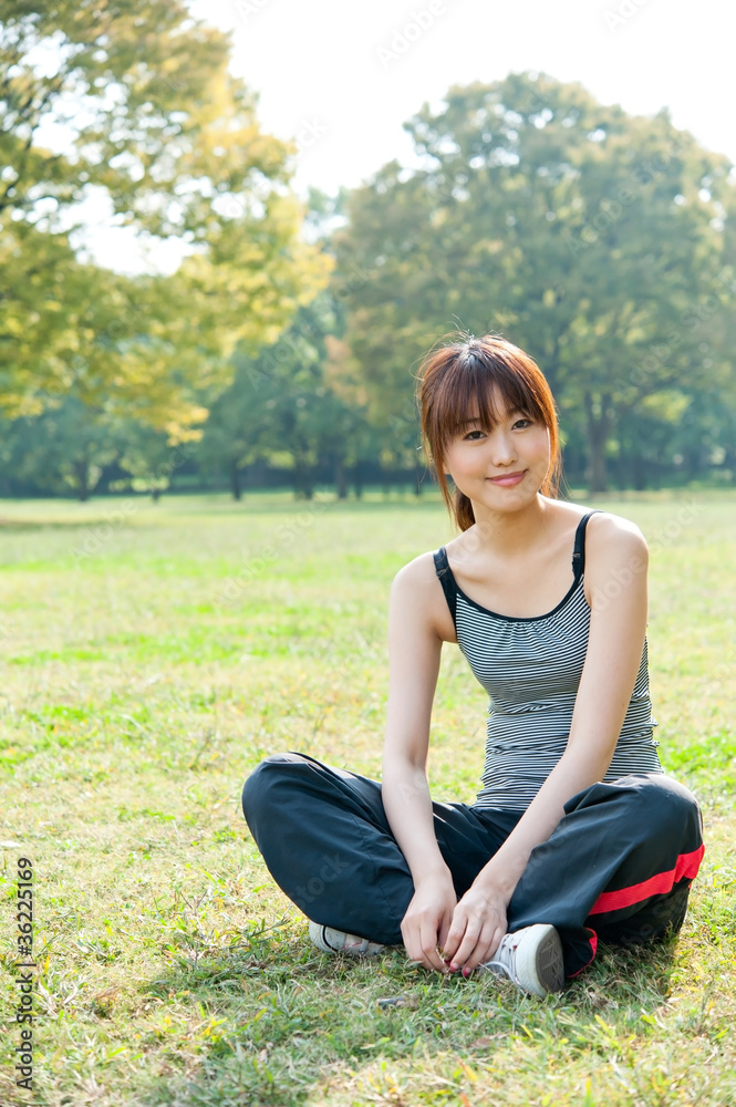 beautiful asian woman relaxing in the park