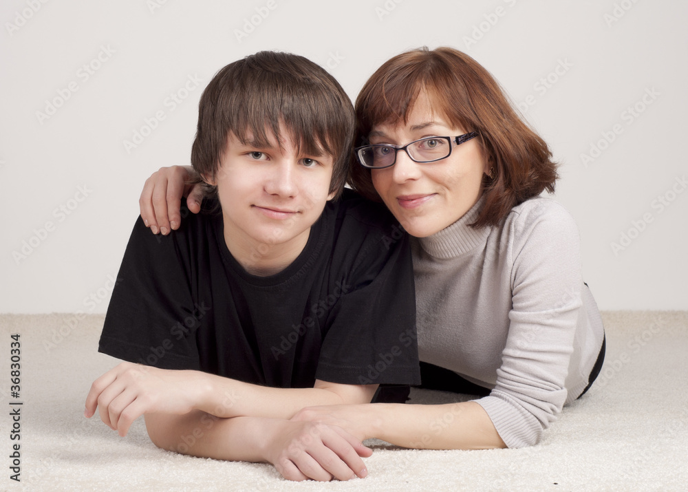 mother and son are together and smile