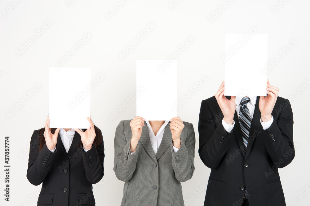 business team holding a blank whiteboard