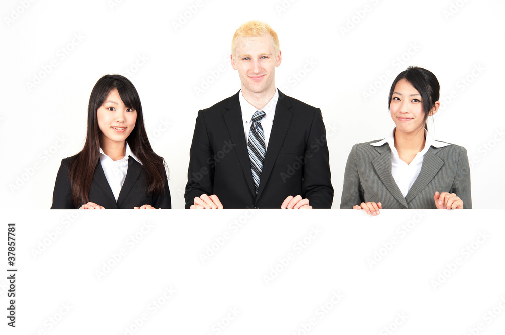 business team holding a blank whiteboard