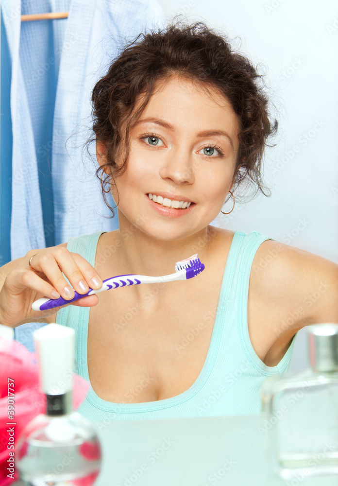 Toothbrush and smiling woman