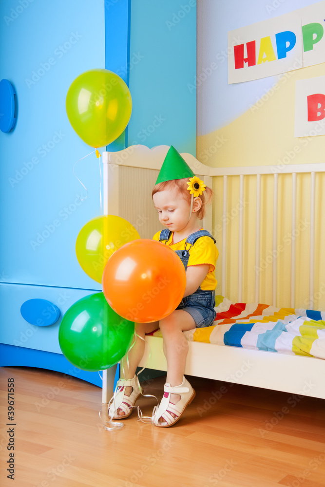 Little girl with balloons