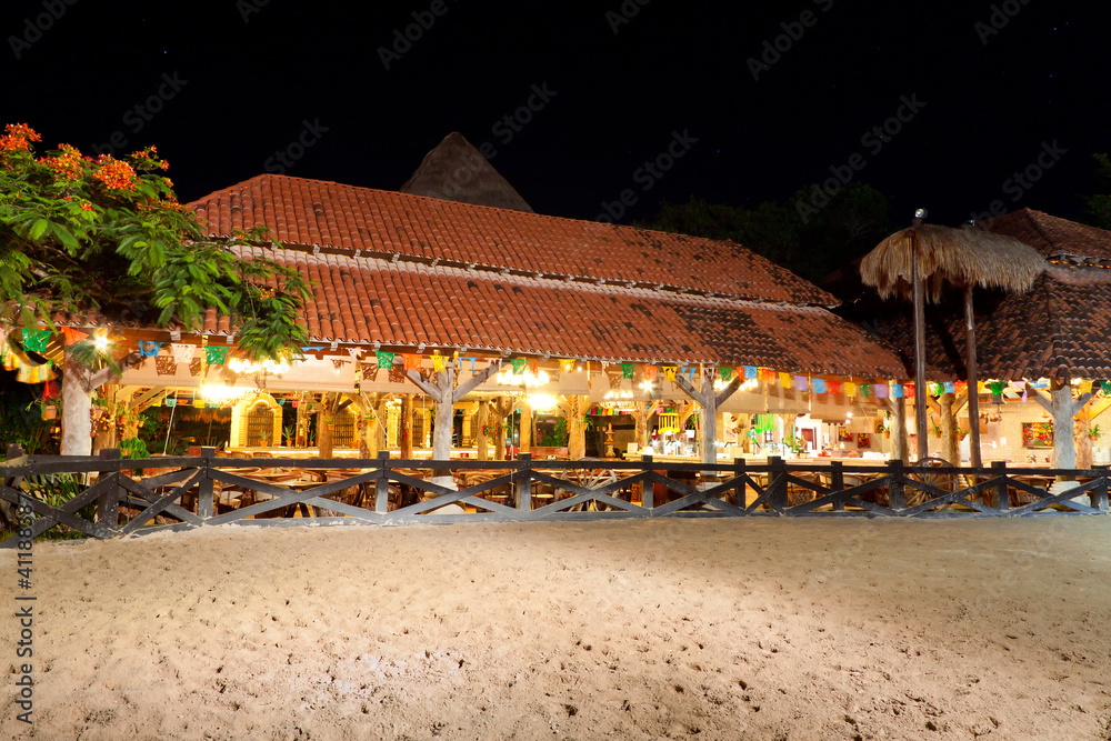 Mexican hacienda at night with horse paddock