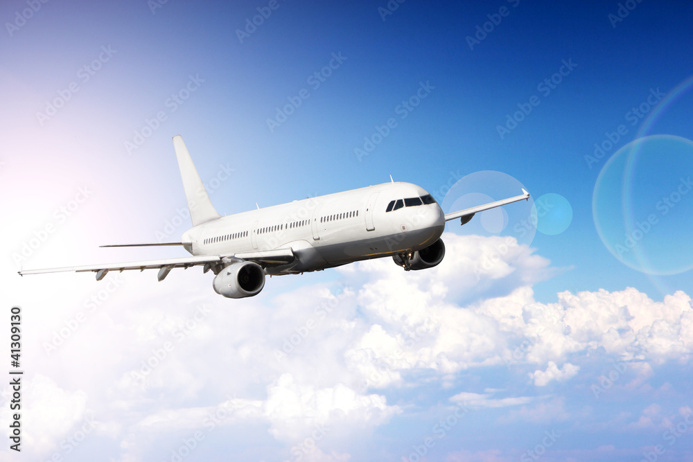 Big jet plane flying above clouds