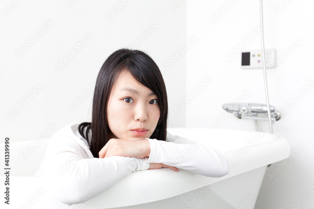 attractive asian woman in bathroom