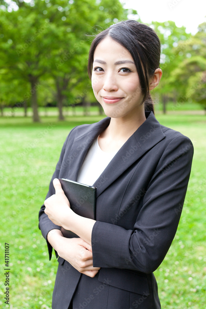 asian businesswoman in the park