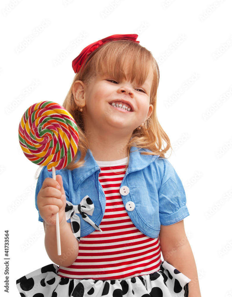 Happy girl smiling and holding lollipop