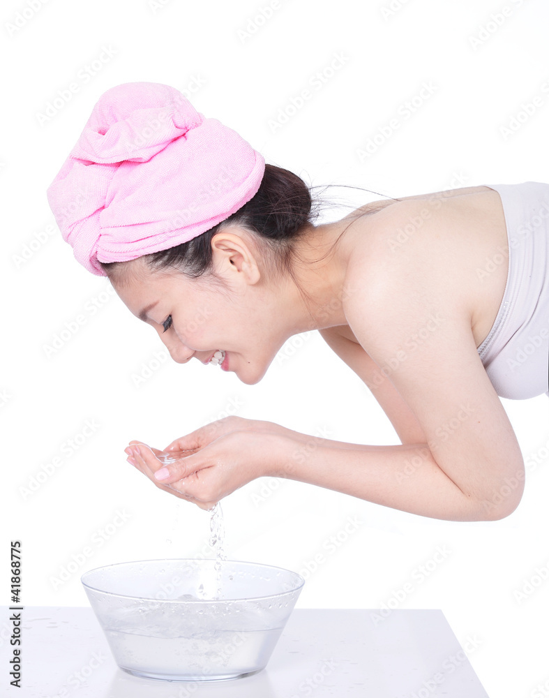 Profile portrait of woman washing face