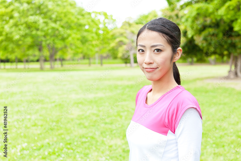 young asian woman relaxing in the park