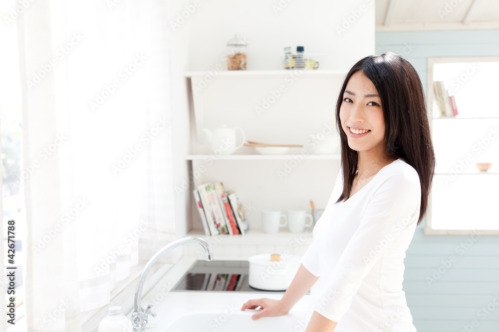 a young asian woman in the kitchen