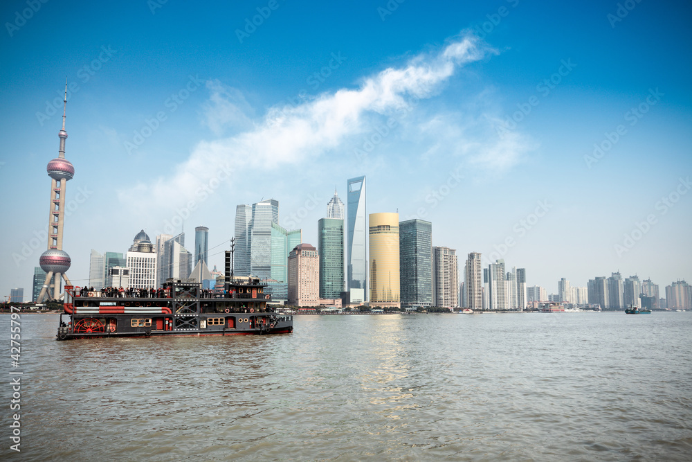 shanghai skyline and pleasure boat