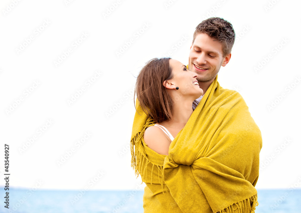 Couple Wrapped with Blanket Looking at Each Other