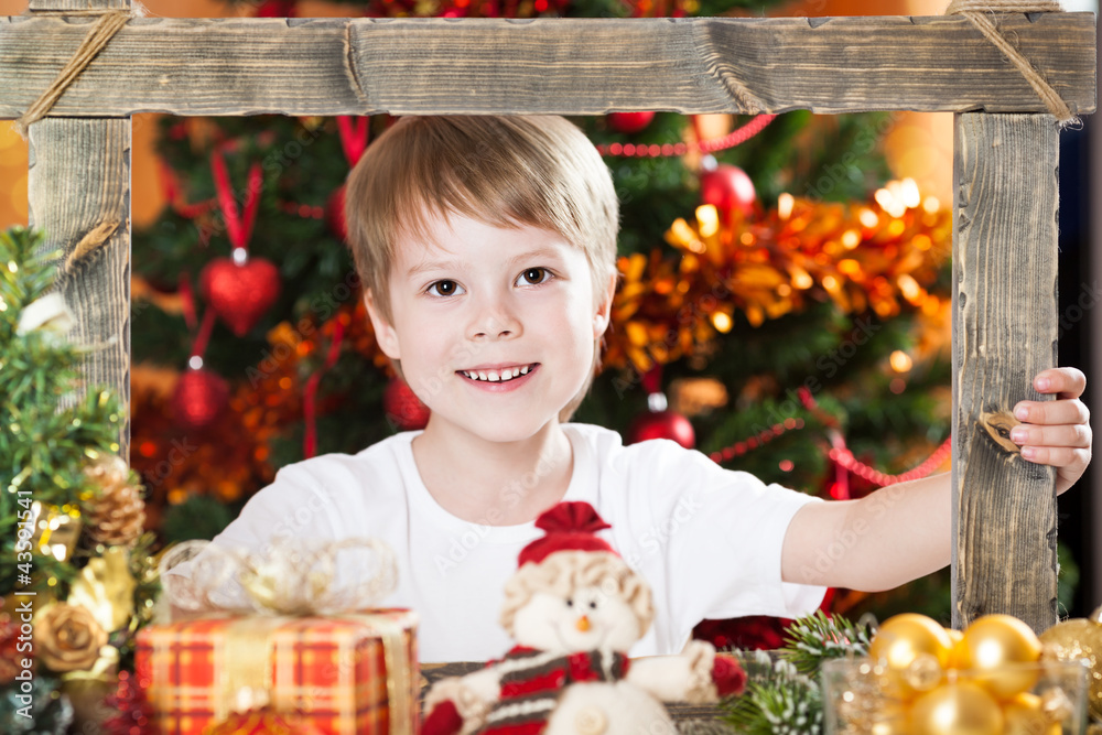 Happy boy looking into frame