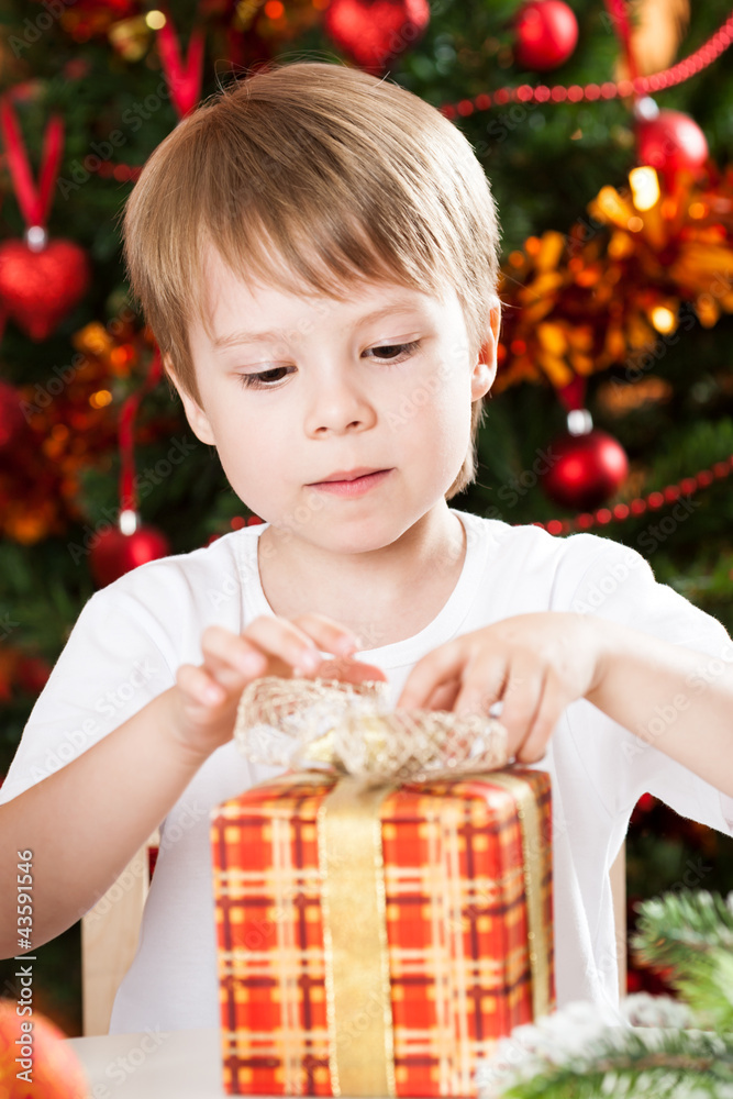 Boy opening Xmas present