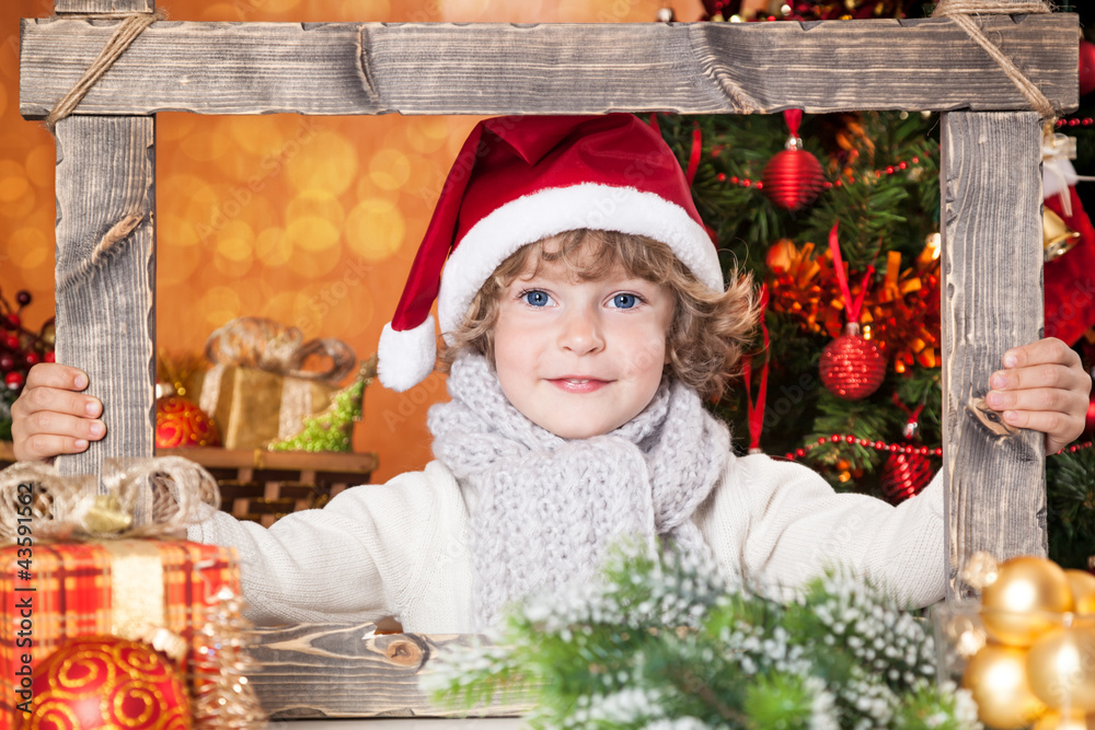 Happy child holding frame