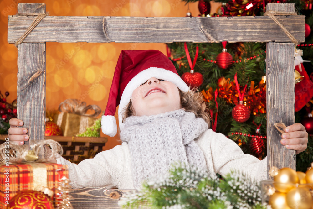 Funny child holding frame