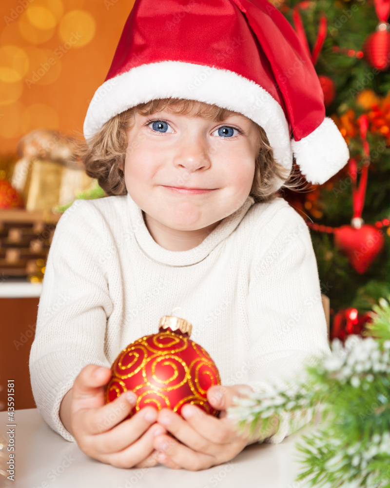 Happy child holding ball