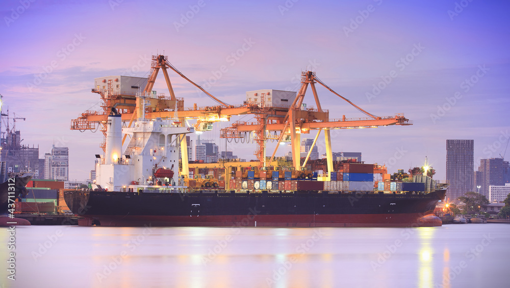 Container Cargo freight ship with working crane bridge in shipya