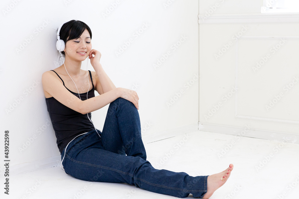 a young asian woman relaxing in the room