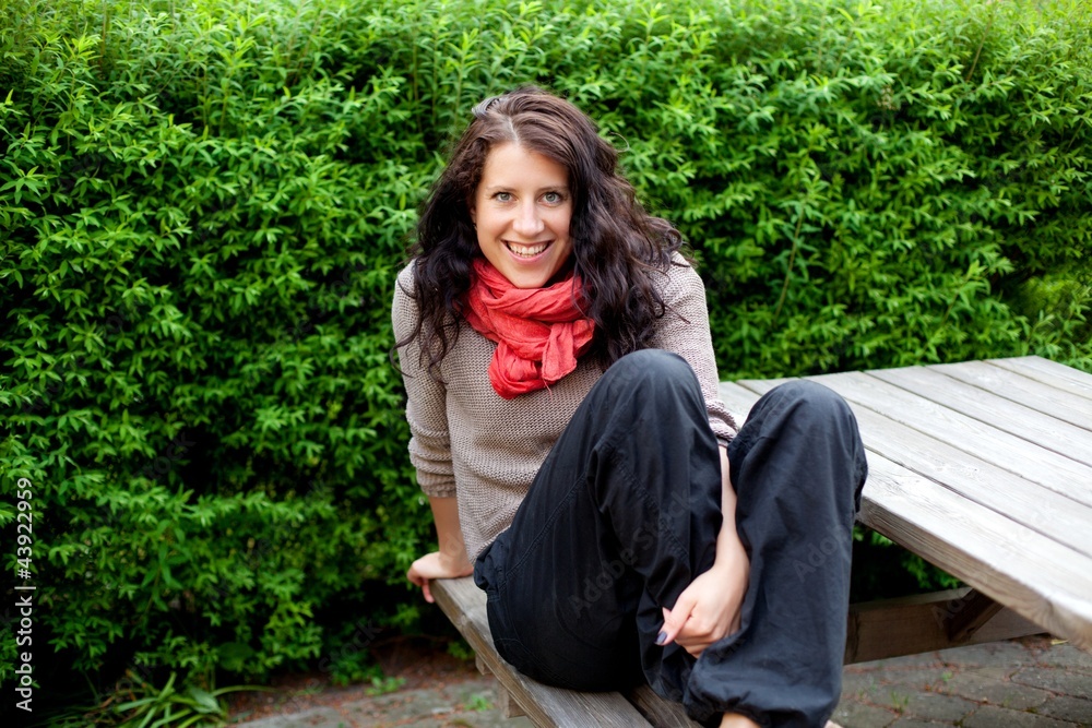 Smiling Woman Resting on a Park