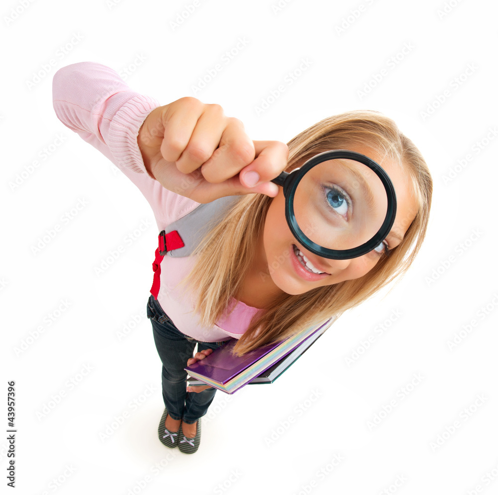 Funny Schoolgirl Looking Through The Magnifying Glass