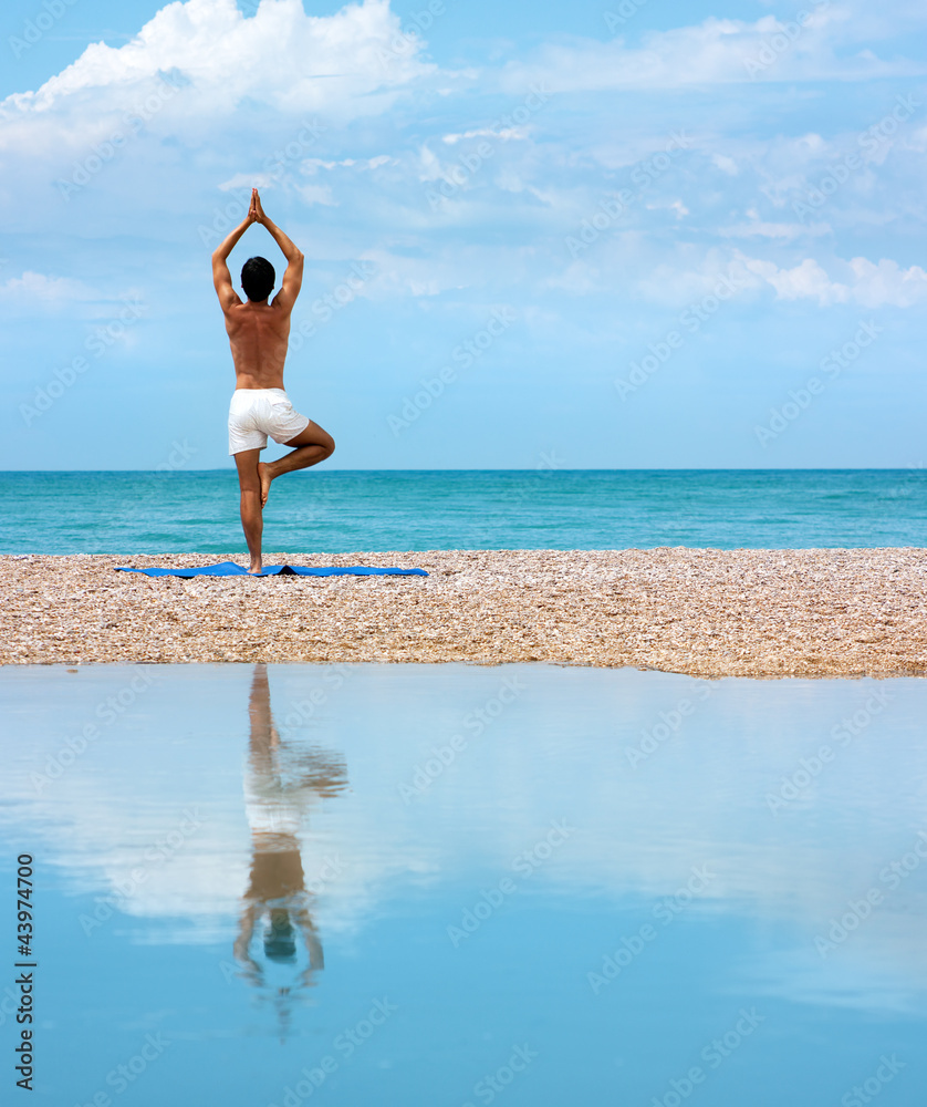 Man Doing Yoga. Vrikshasana Pose (The Tree)