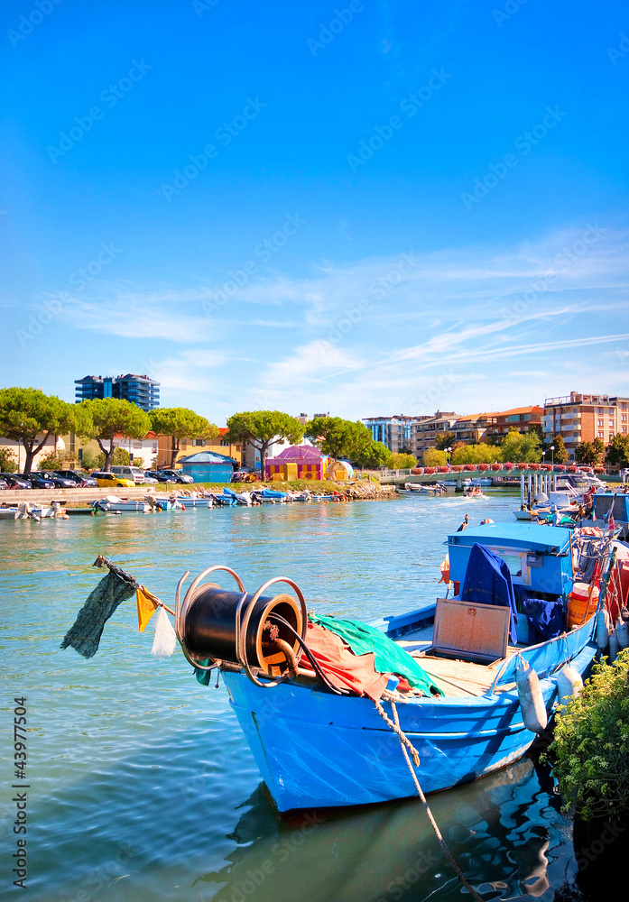 Beautiful fisherman boat in the city centre of Grado, Italy.