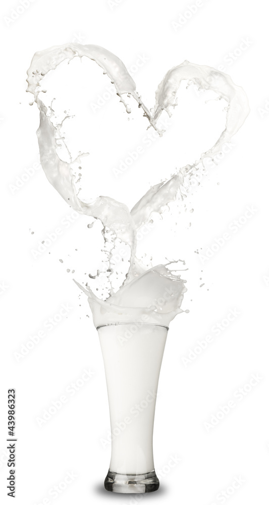 Heart symbol up the glass, made of milk splashes