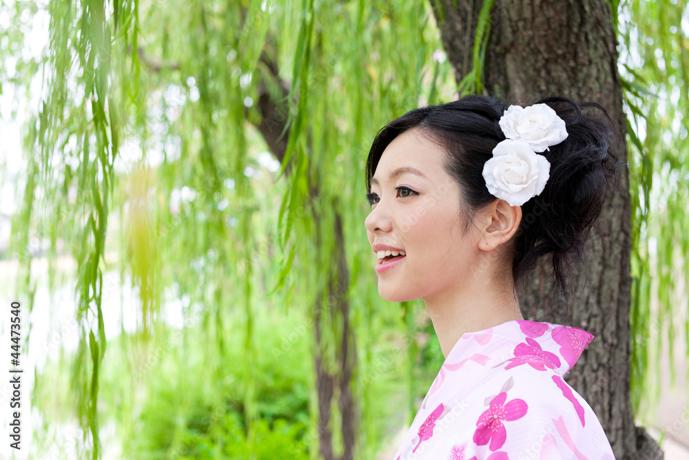 japanese kimono woman standing under tree