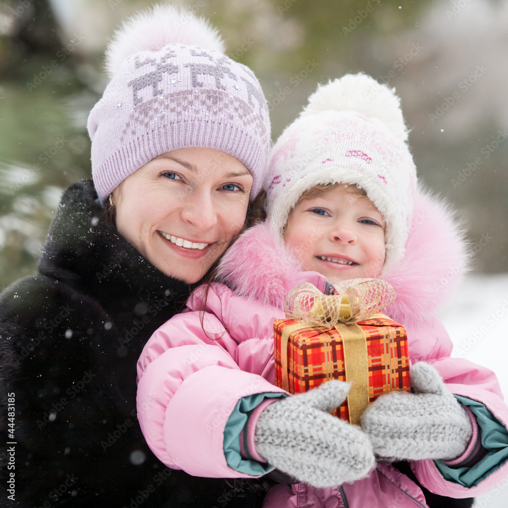 Happy family with Christmas gift