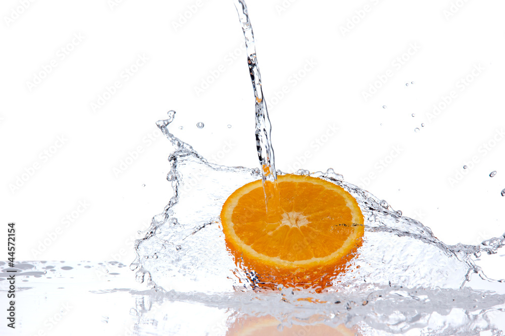  Orange slice in water splash, isolated on white background