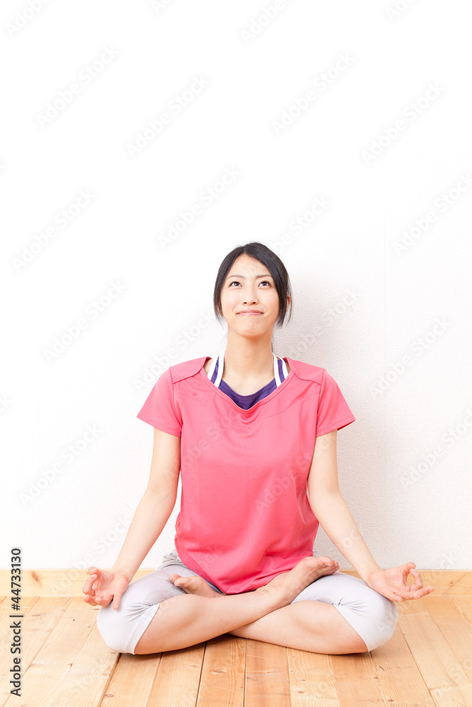 a beautiful asian woman streching 