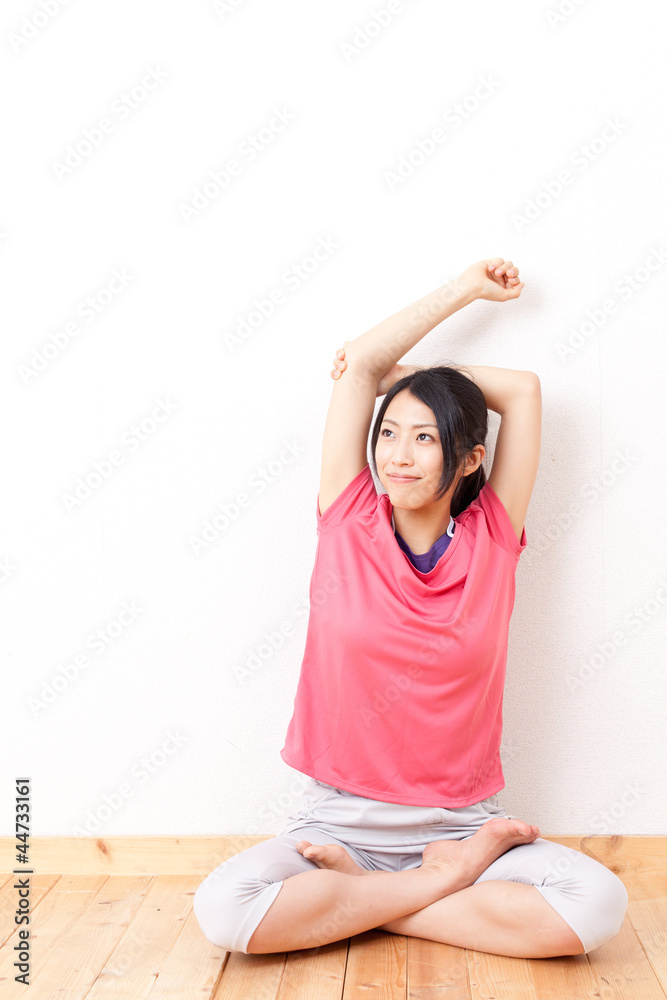 a beautiful asian woman streching 