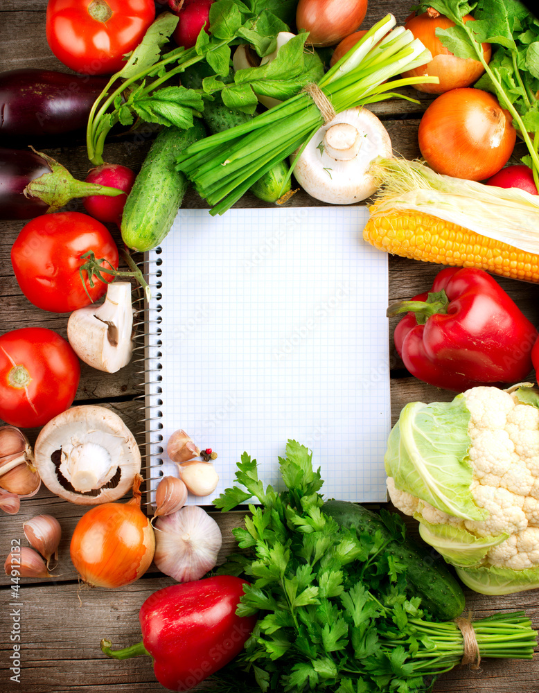 Open Notebook and Fresh Vegetables Background. Diet