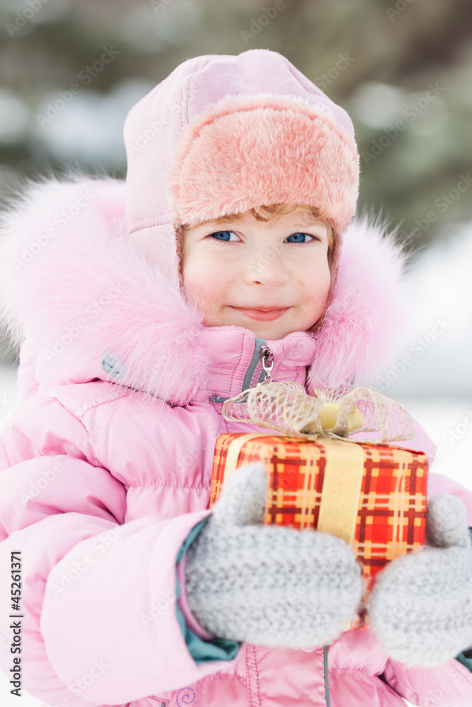 Child holding Christmas gift