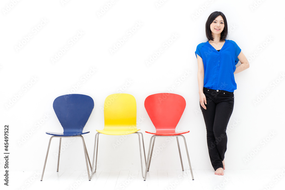 a young asian woman with colorful chair