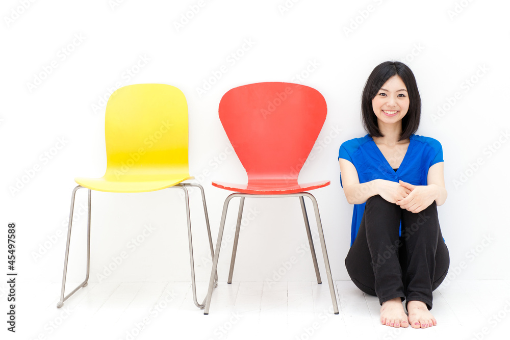 a young asian woman with colorful chair